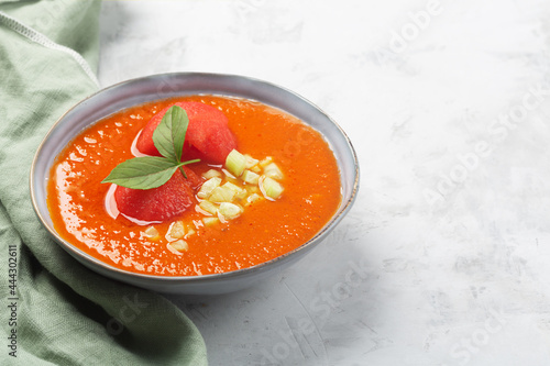 A plate of traditional Spanish vegetable gazpacho with water melon photo