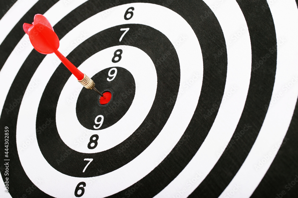 Red darts for setting business success goals. Red darts for setting business success goals.