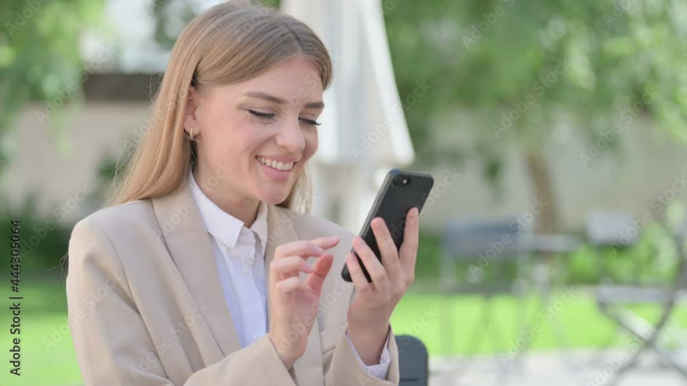Outdoor Young Businesswoman Celebrating on Smartphone Outdoor Young Businesswoman Celebrating on Smartphone