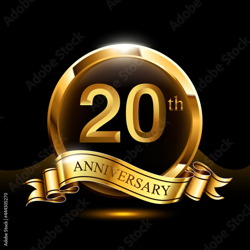 20 years golden anniversary logo celebration with ring and ribbon.