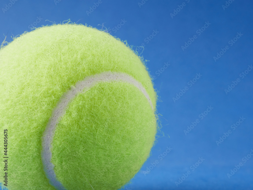 Tennis ball isolated on a blue background