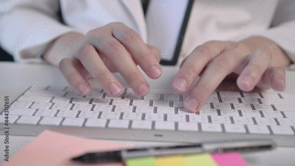 salary employee working at her desk in the office during office hours. salary employee working at her desk in the office during office hours.