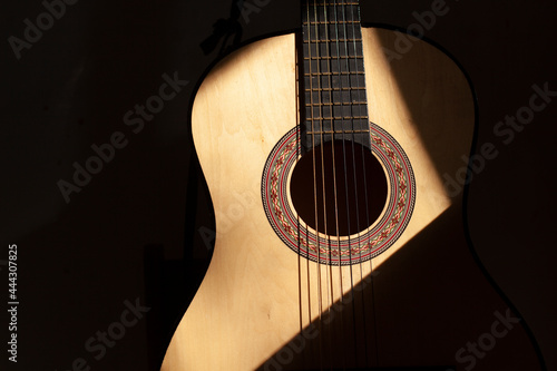 Acoustic guitar. A guitar with six strings.