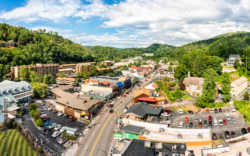Aerial view of Gatlinburg above US-441. Gatlinburg is a popular mountain resort city in Sevier County, Tennessee, as it rests on the border of Great Smoky Mountains National Park. © mandritoiu