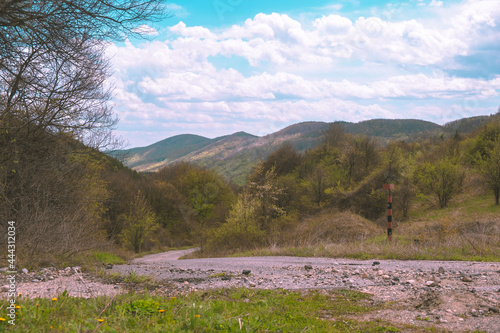 Mountain view , road and a sign