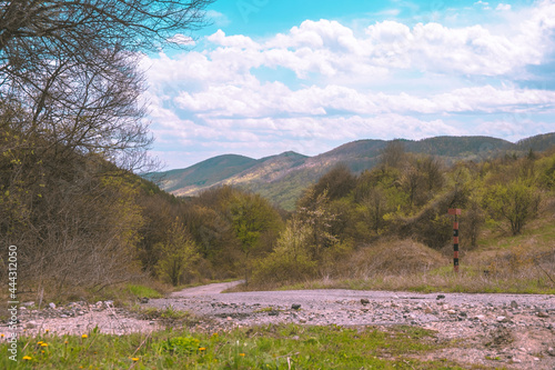 Mountain view , road and a sign