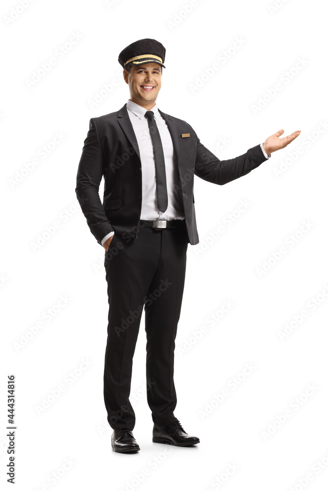 Full length portrait of a smiling chauffeur gesturing with hand Full length portrait of a smiling chauffeur gesturing with hand