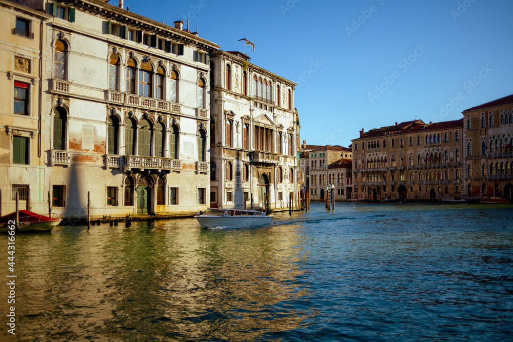 landscape with motorboat and grand canal in Venice, Italy