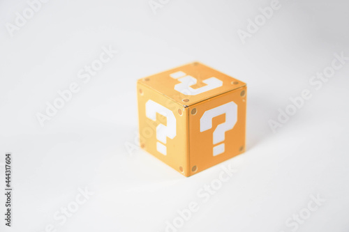 orange metal toy blocks with a question mark