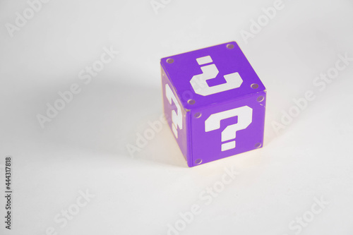 purple metal toy block with a question mark