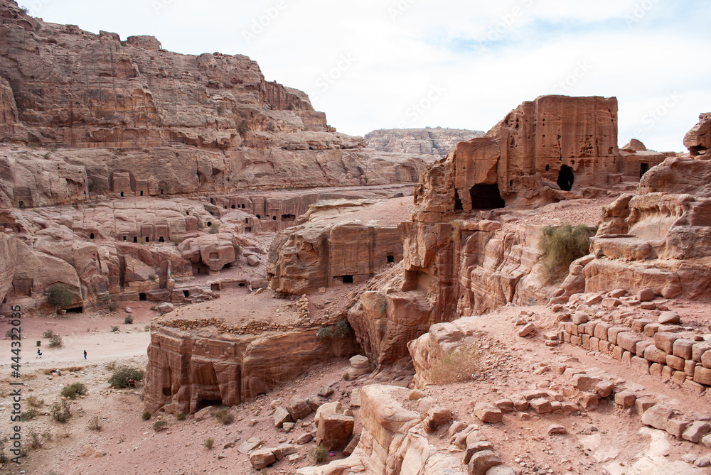 The ancient city of Petra in Jordan became one of the 7 New Wonders of the World. The city's carved rose-red sandstone rock facades, tombs, and temples. 