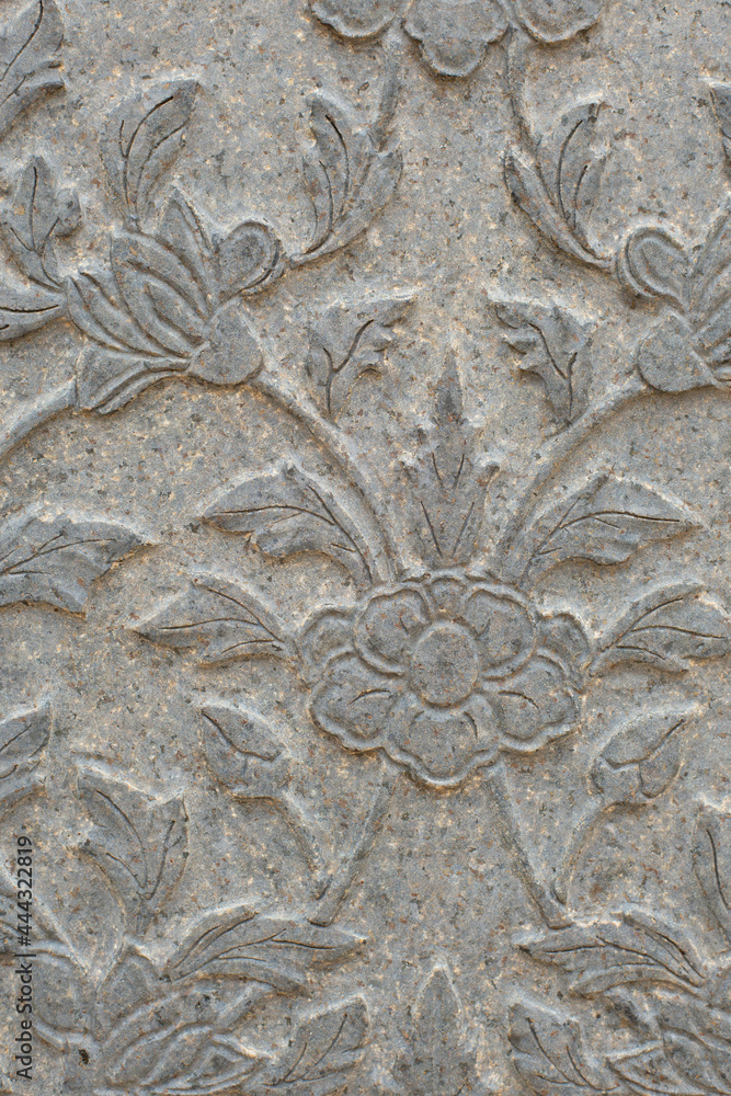 Sculptures carved floral motifs on the stone surface. that is handcrafted