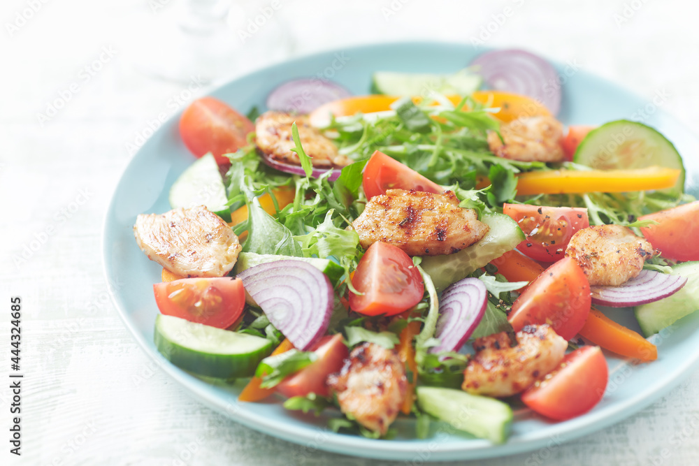 Healthy Salad with Chicken Breast, Cherry Tomatoes, Cucumber, Orange Pepper, Endive and Red Onion. Close up. Healthy Salad with Chicken Breast, Cherry Tomatoes, Cucumber, Orange Pepper, Endive and Red Onion. Close up.