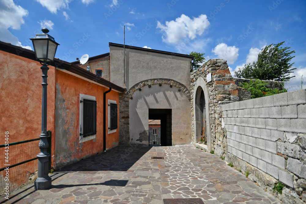 Vallata, Italy, July 3, 2021. A street between the old houses of a medieval village in Campania region.