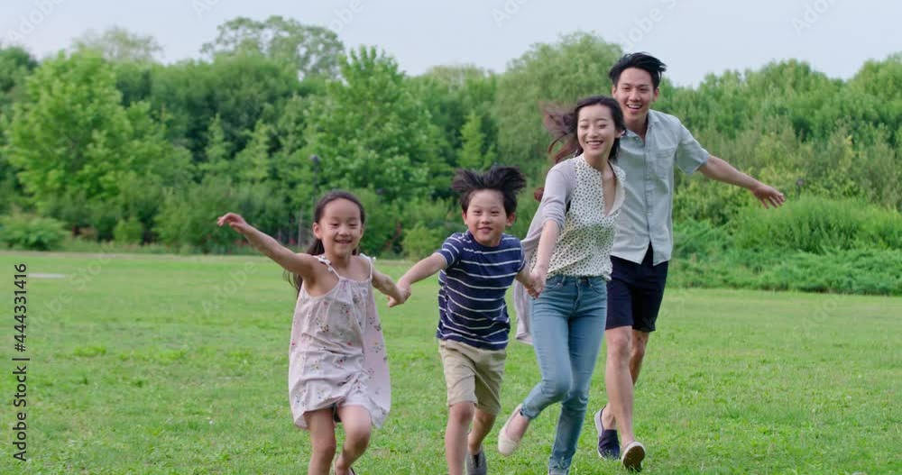 Happy young family running on grass,4K Happy young family running on grass,4K