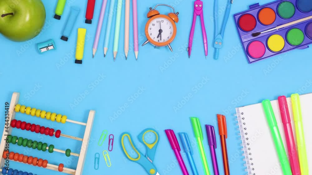 Back to school stationery for children appear on top and bottom of blue theme with copy space. Stop motion Back to school stationery for children appear on top and bottom of blue theme with copy space. Stop motion