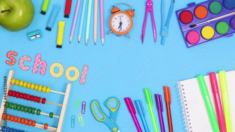 Time for school stop motion. School tools appear on blue theme with copy space. Stop motion