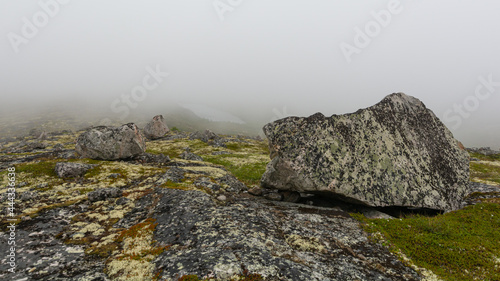 Granite hills, rocks, and fog.
