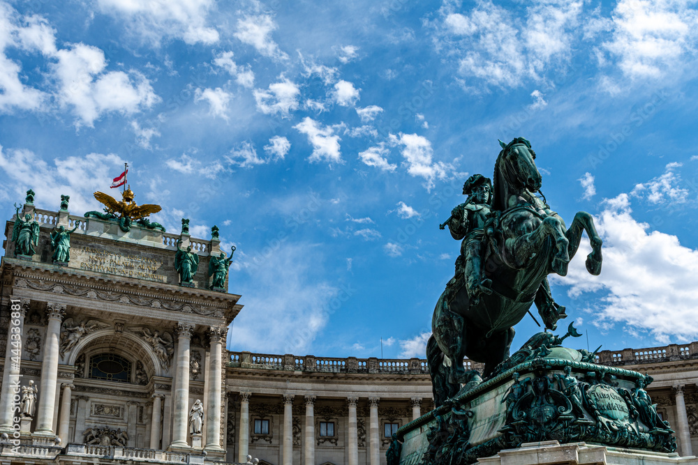 Low angle view of the Statue of Prince Eugene on the Herosquare in Vienna, Austria in front of the Hofburg Palace