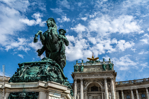 Low angle view of the Statue of Prince Eugene on the Herosquare in Vienna, Austria in front of the Hofburg Palace