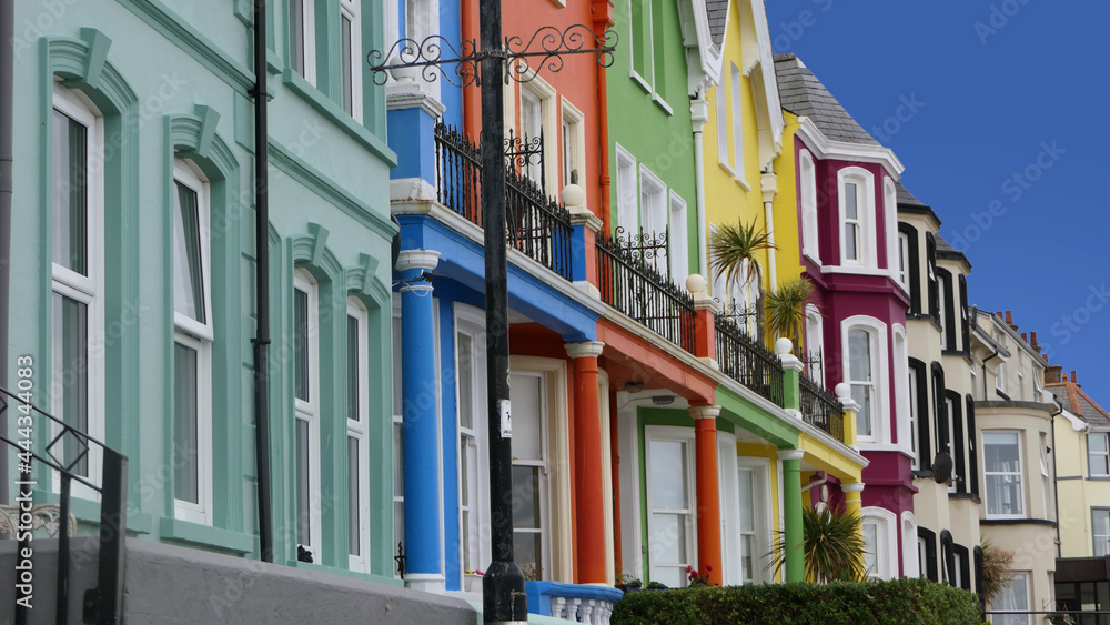 Yellow Red Orange Green Blue sky houses by the sea Whitehead N. Ireland Yellow Red Orange Green Blue sky houses by the sea Whitehead N. Ireland