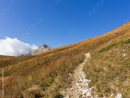 Panoramic views of the mountains from hiking trails in the mountainous area on a warm, sunny autumn day, walking and communicating with nature. © NAIL BATTALOV