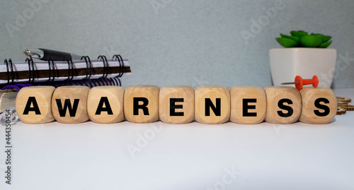 awareness word written on wood block. awareness text on table, concept