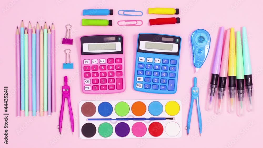 Creative pastel back to school layout made of moving vibrant school accessories on pastel pink theme. Stop motion Creative pastel back to school layout made of moving vibrant school accessories on pastel pink theme. Stop motion