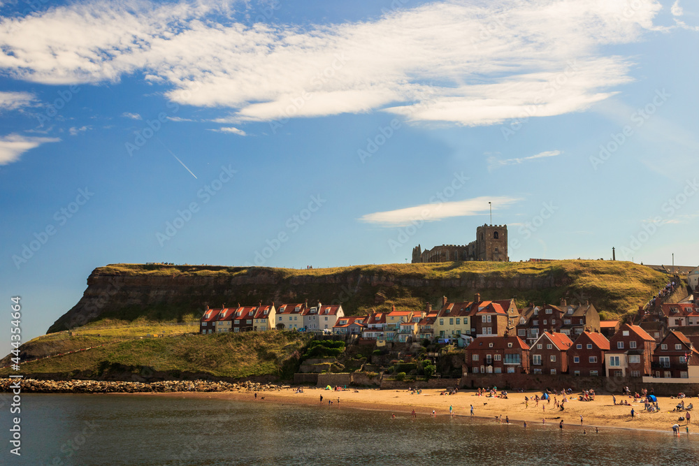 Naklejka premium People enjoying the beach of Whitby Bay