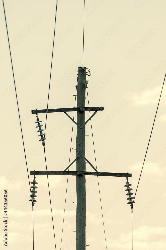 Photograph of a wooden telephone post and cables Photograph of a wooden telephone post and cables