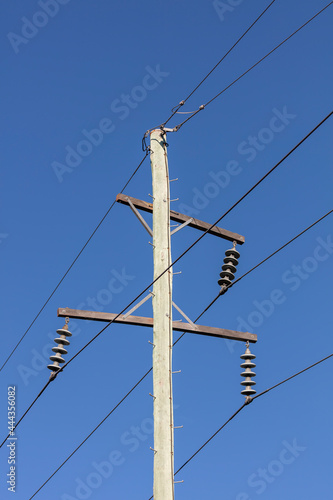 Photograph of a wooden telephone post and cables