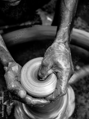 close up of hands of a potter photo