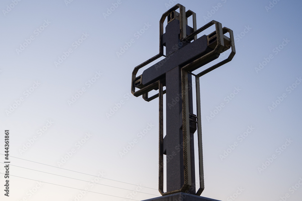 large old church cross made of stone and metal