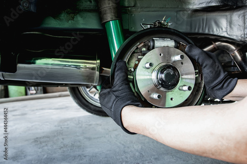 Slika na platnu A man change Auto hub bearing  wheel of car for maintenance concept and tool for