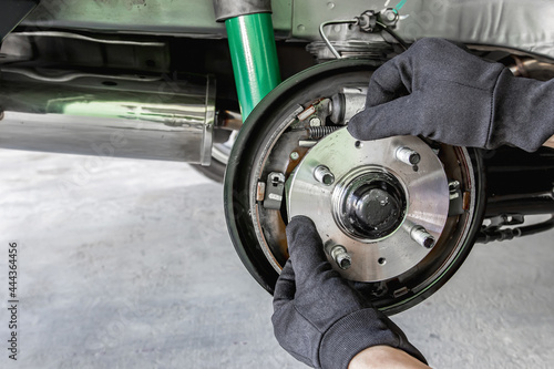 Close up hand a man change bearing of wheel in the car maintenance concept