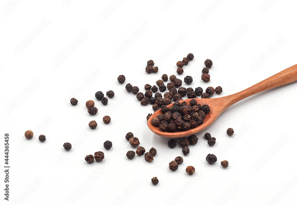 black pepper in a wooden bowl isolated on white background black pepper in a wooden bowl isolated on white background