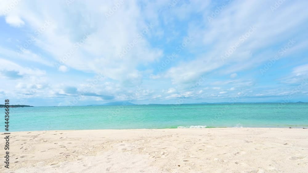 Beautiful view of sand beach and ocean wave with blue sky and cloud in the background. Holiday vacation time. Beautiful view of sand beach and ocean wave with blue sky and cloud in the background. Holiday vacation time.