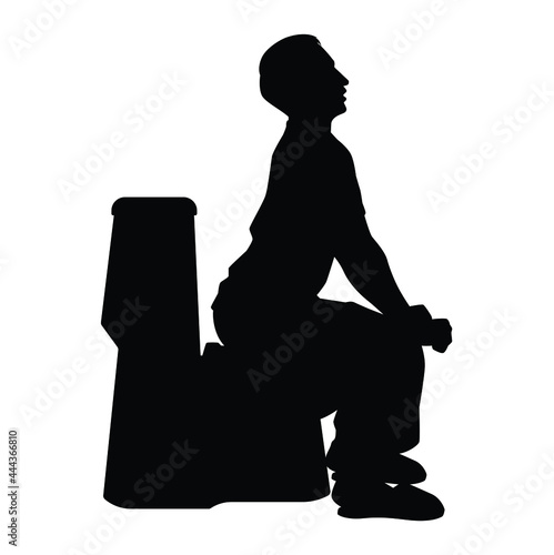 Young man sitting in the toilet bowl silhouette on white background