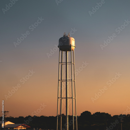 A water tower in East Texas at sunset photo