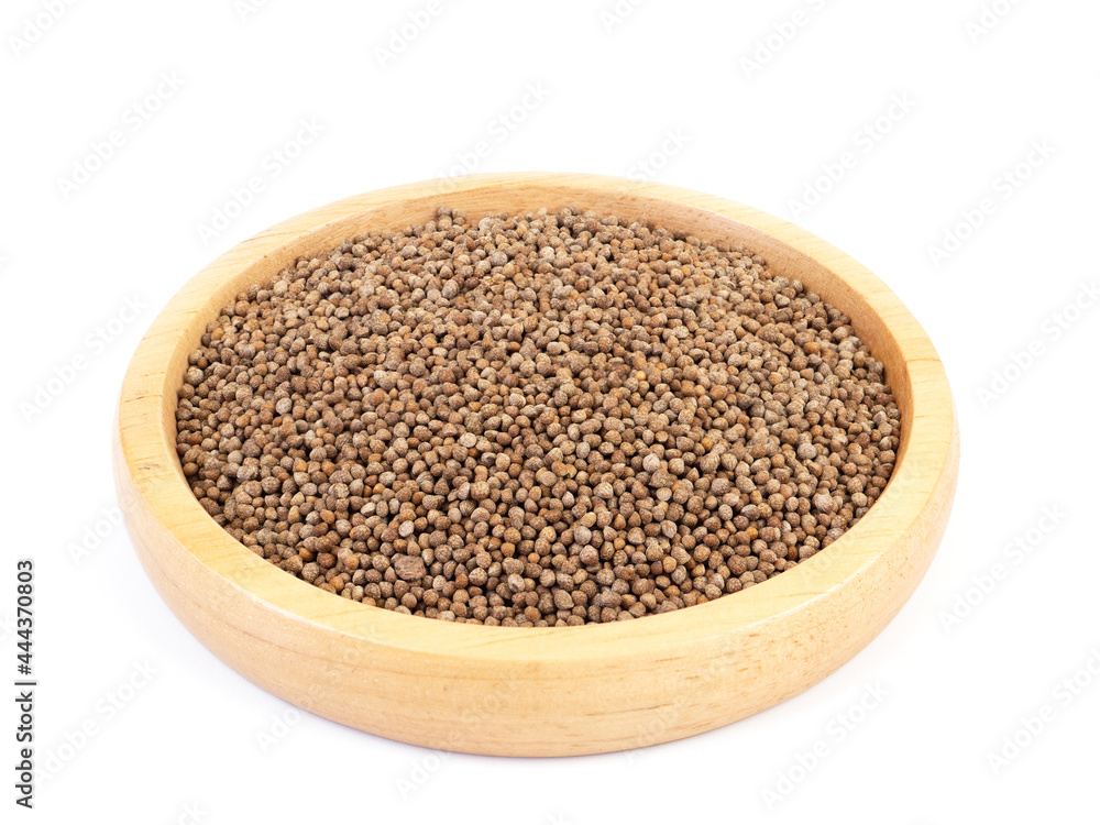 Perilla seed in wooden plate isolated on a white background. Healthy food. . Perilla seed in wooden plate isolated on a white background. Healthy food. .
