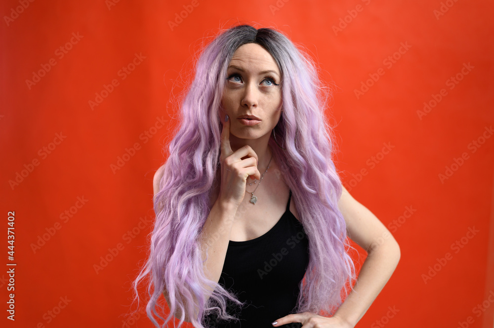 Fototapeta premium Portrait of caucasian cute model on red background
