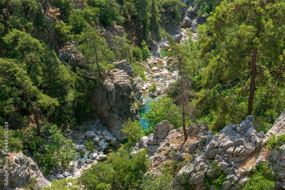 A canyon with a hiking trail. Mountain river. Part of the Lycian trail through the mountain range. A canyon with a hiking trail. Mountain river. Part of the Lycian trail through the mountain range.