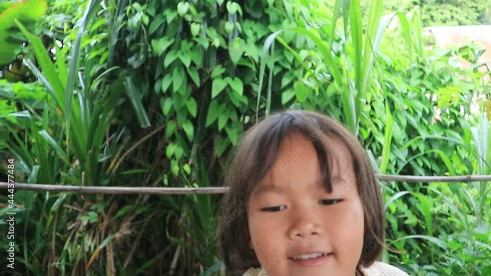 Happy little Asian girl blowing soap bubbles. Happy little Asian girl blowing soap bubbles.