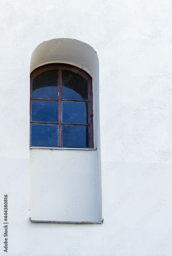 Fototapeta premium Antique window in a white wall