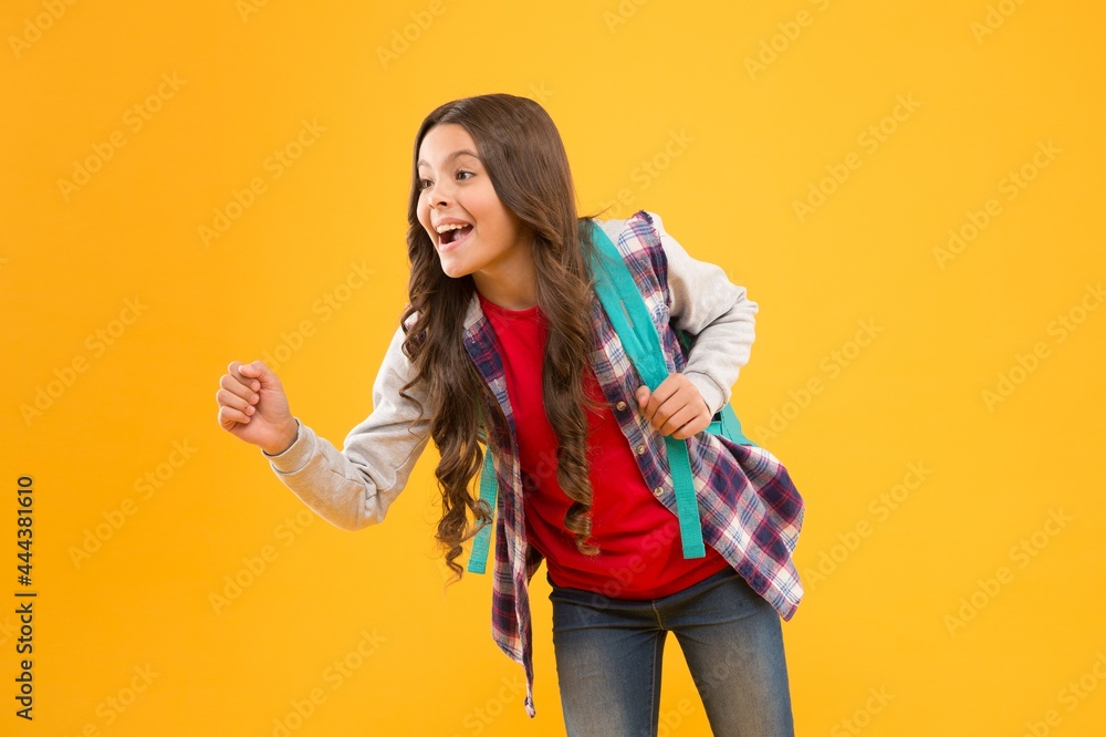 Happy back to school child pretend holding something in hand yellow background, advertising Happy back to school child pretend holding something in hand yellow background, advertising