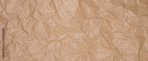 Crumpled craft brown paper, craft texture background. Banner