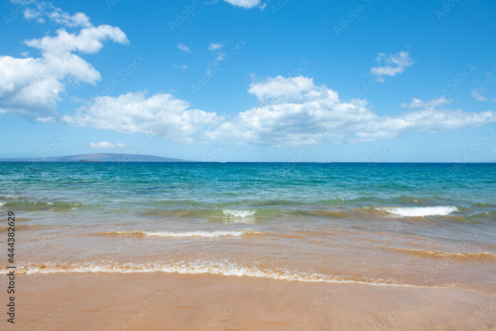 Blue ocean wave on sandy beach. Beach in sunset summer time. Beach landscape. Tropical seascape, calmness, tranquil relaxing sunlight.