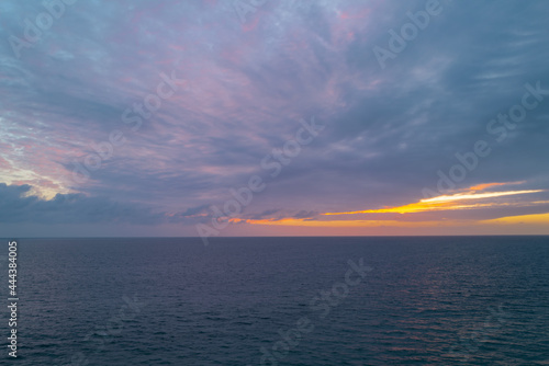 Sunrise over the sea and beautiful cloudscape. Colorful ocean beach sunset. © Volodymyr