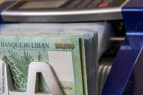 Lebanese Lira Currency being counted by a money counting machine