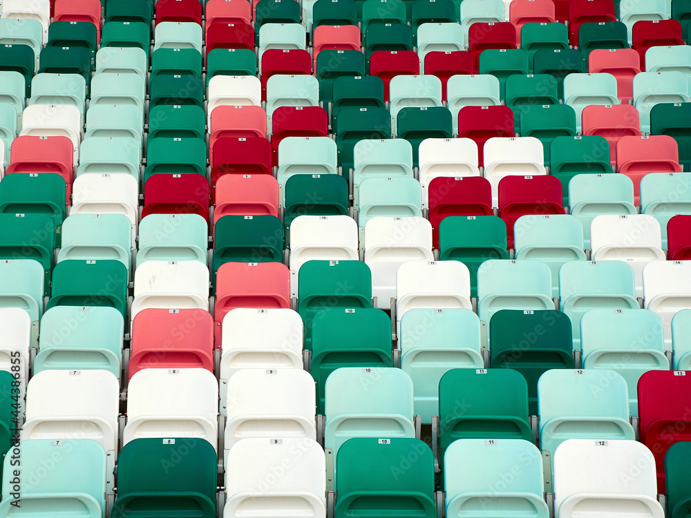 Rows of multi-colored chairs in the stadium
